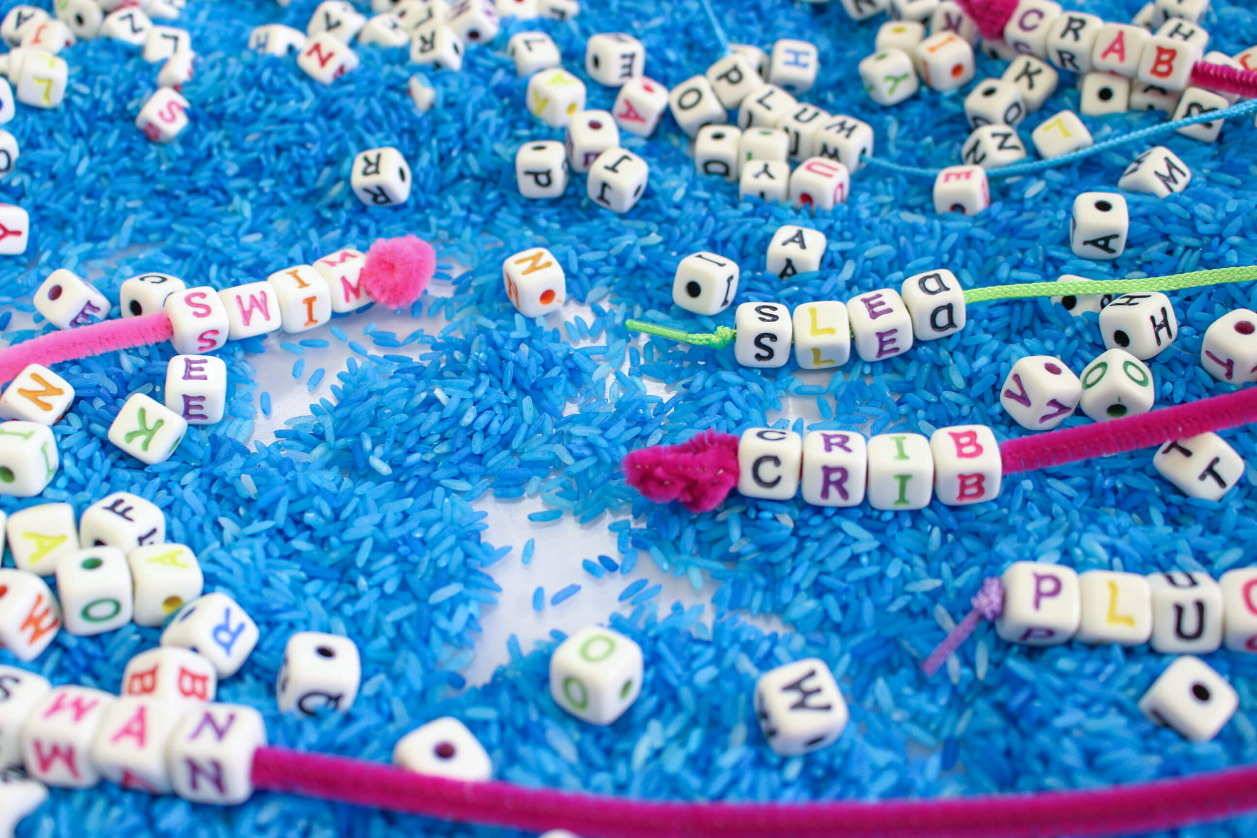 Alphabet beads word building sensory bin