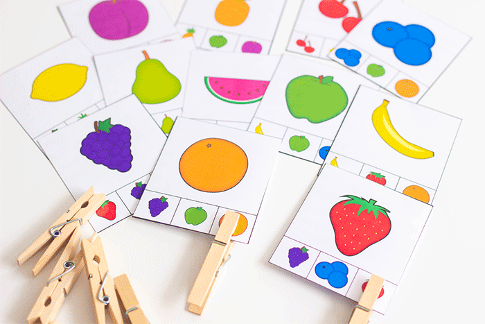 kindergarten fruit-themed counting activity with clip cards and clothespins