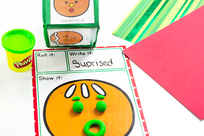 Roll and make emotions play dough mats with gingerbread winter theme