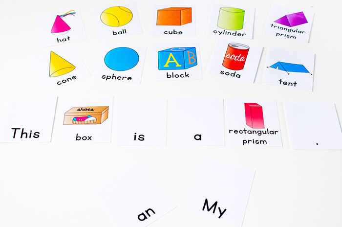 Labeled 3D shape cards and word cards for sentence building.