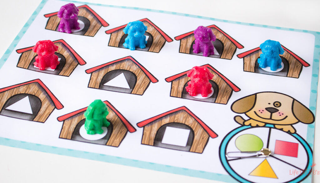 Spin and cover the dog houses with the matching shapes.