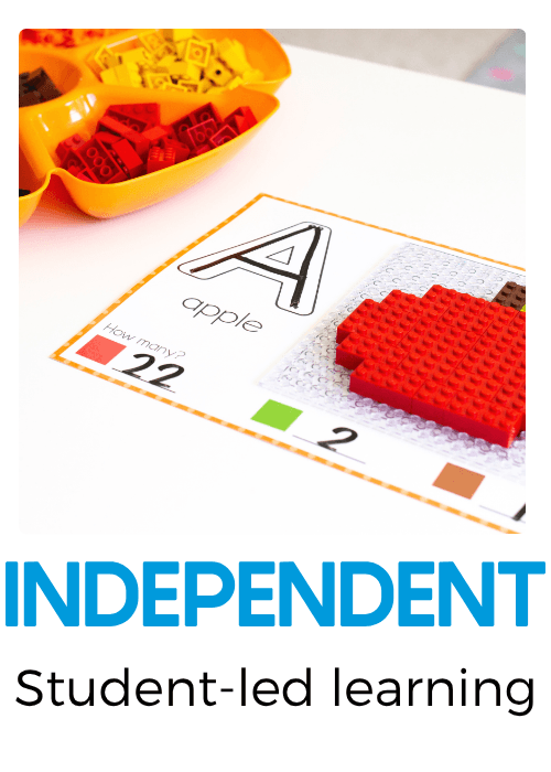 Independent alphabet learning activity featuring an uppercase letter A and apple picture mat with red building bricks, allowing preschoolers to practice letter recognition, beginning sounds, counting, and fine motor skills.